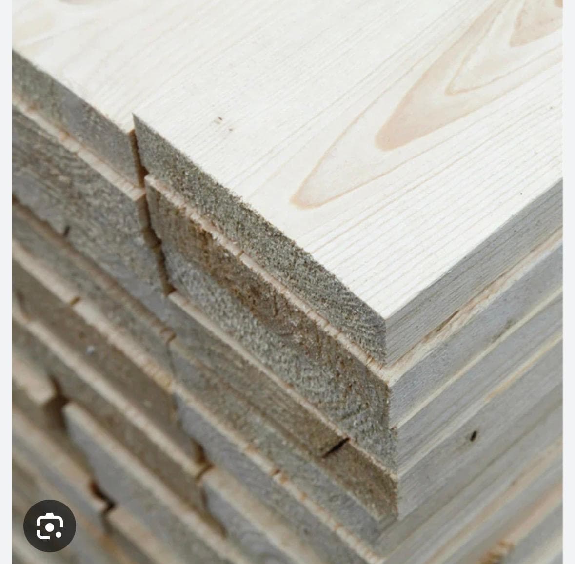 Close-up of natural wood materials stacked in a professional lumber pack